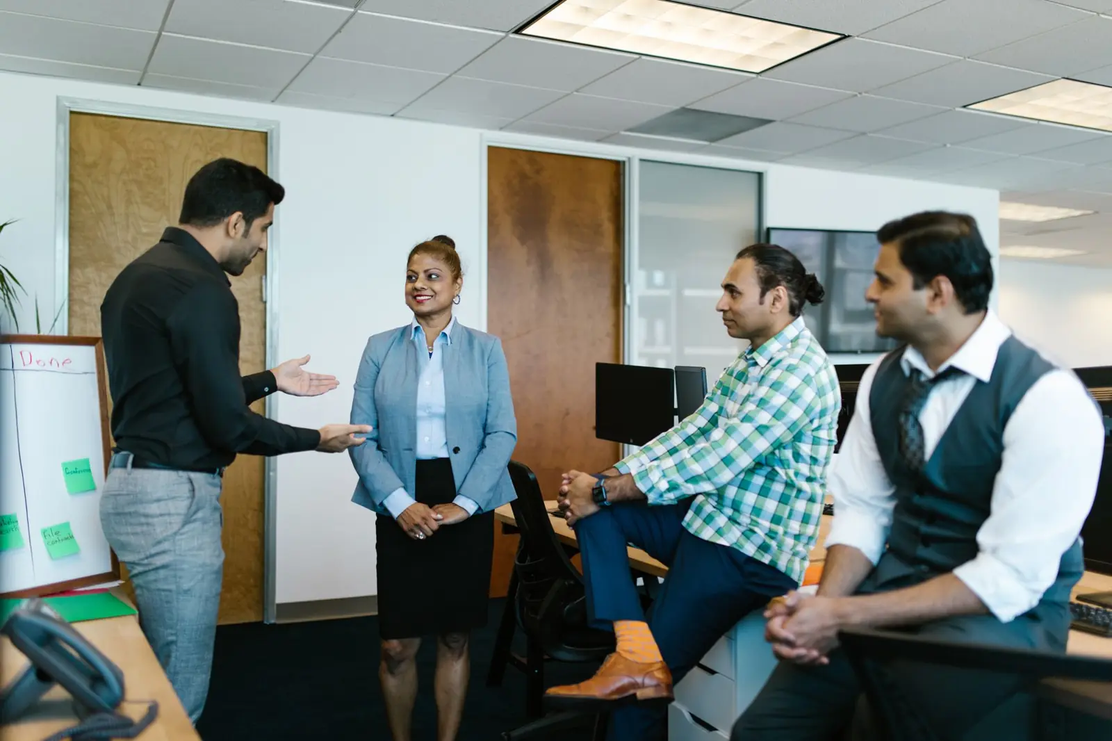 A team of colleagues in discussion during a meeting in a modern office