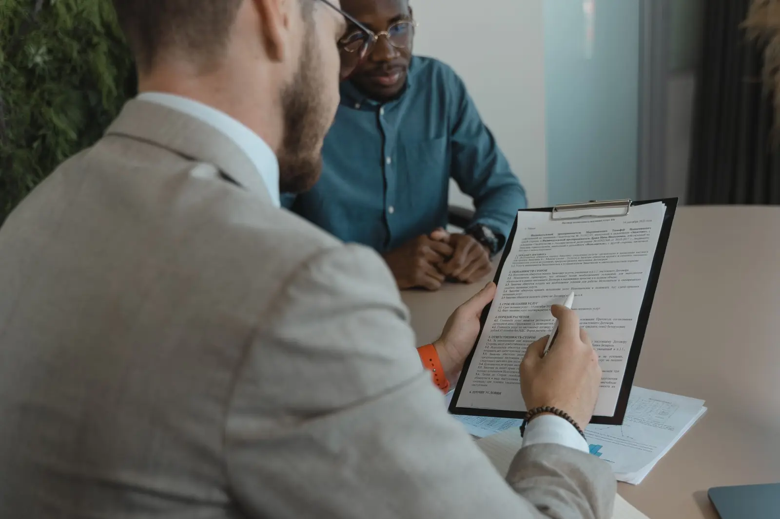 A recruiter reviewing a candidate's documents during an interview